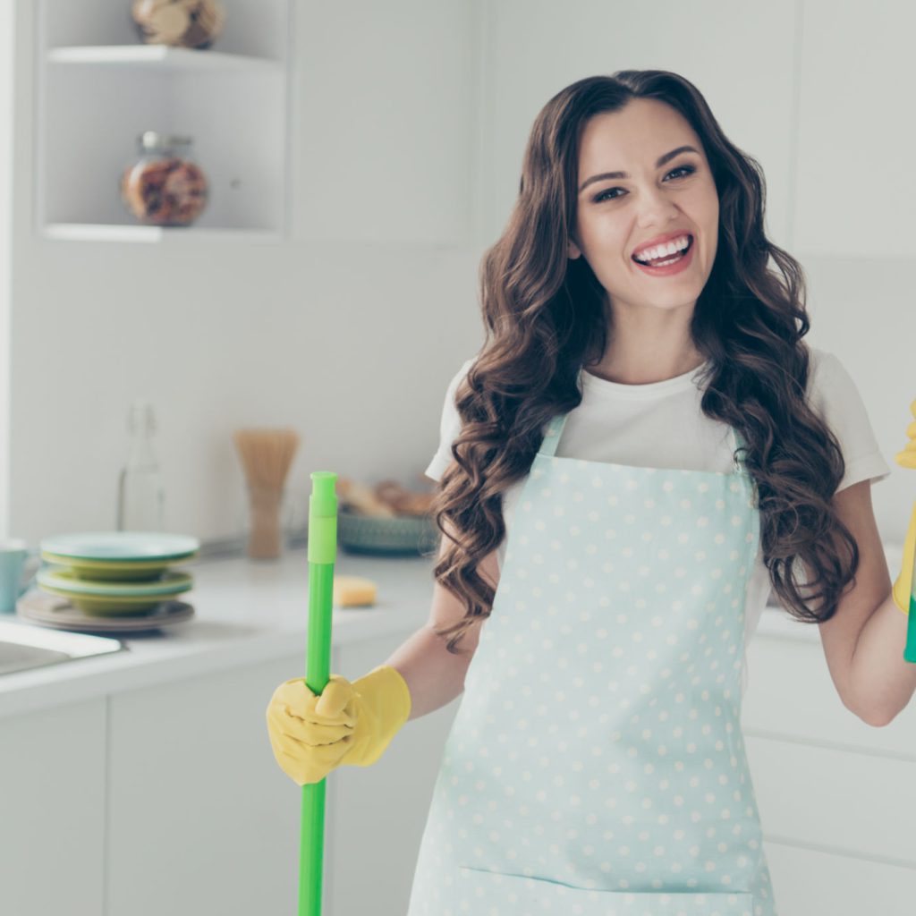 Close up photo beautiful busy nice duties she her lady house hold thumb up washing supplies pulverize promo housemaid wear jeans denim casual t-shirt covered by cute apron bright light kitchen